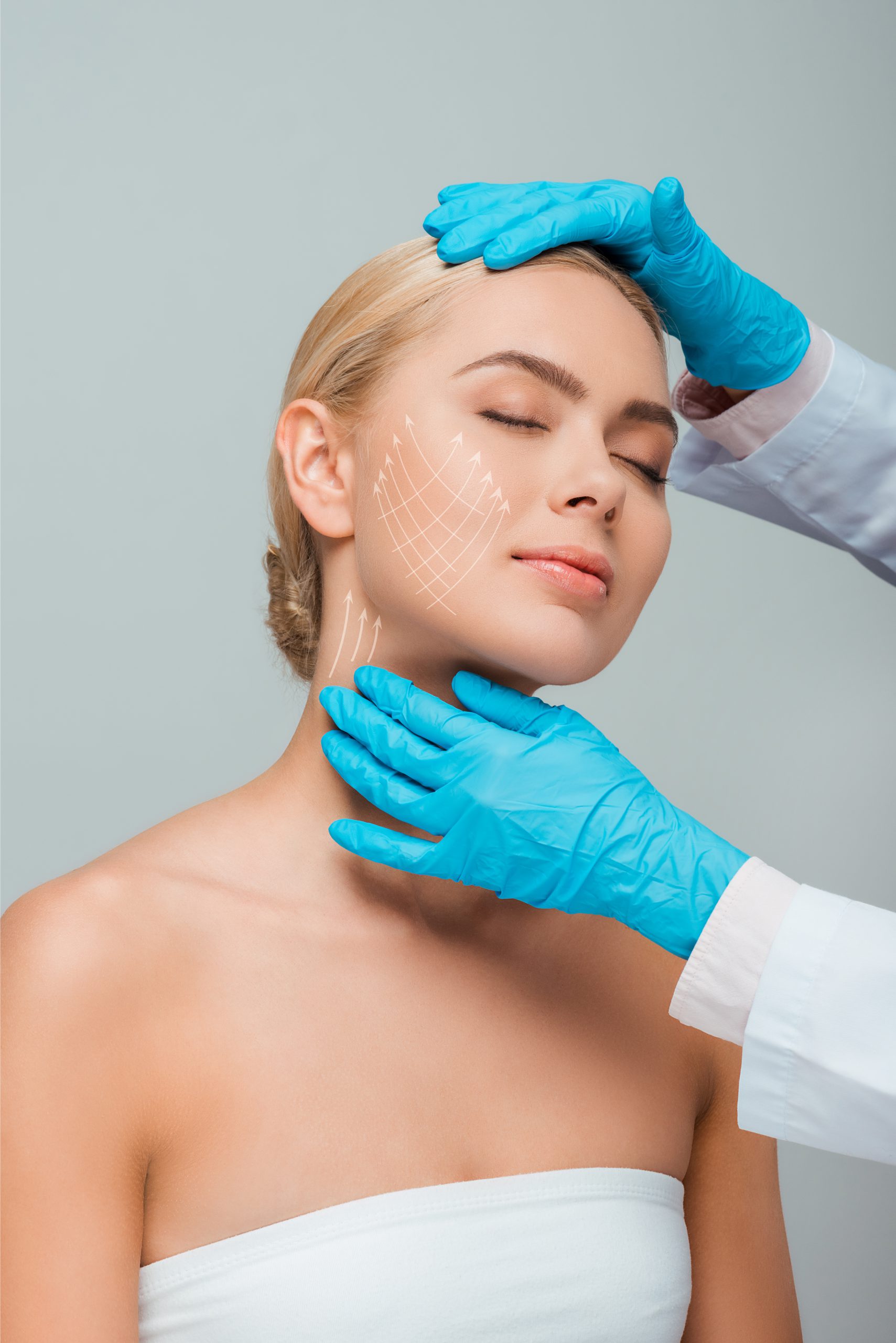 cropped view of beautician in blue latex gloves touching woman with closed eyes and plastic surgery