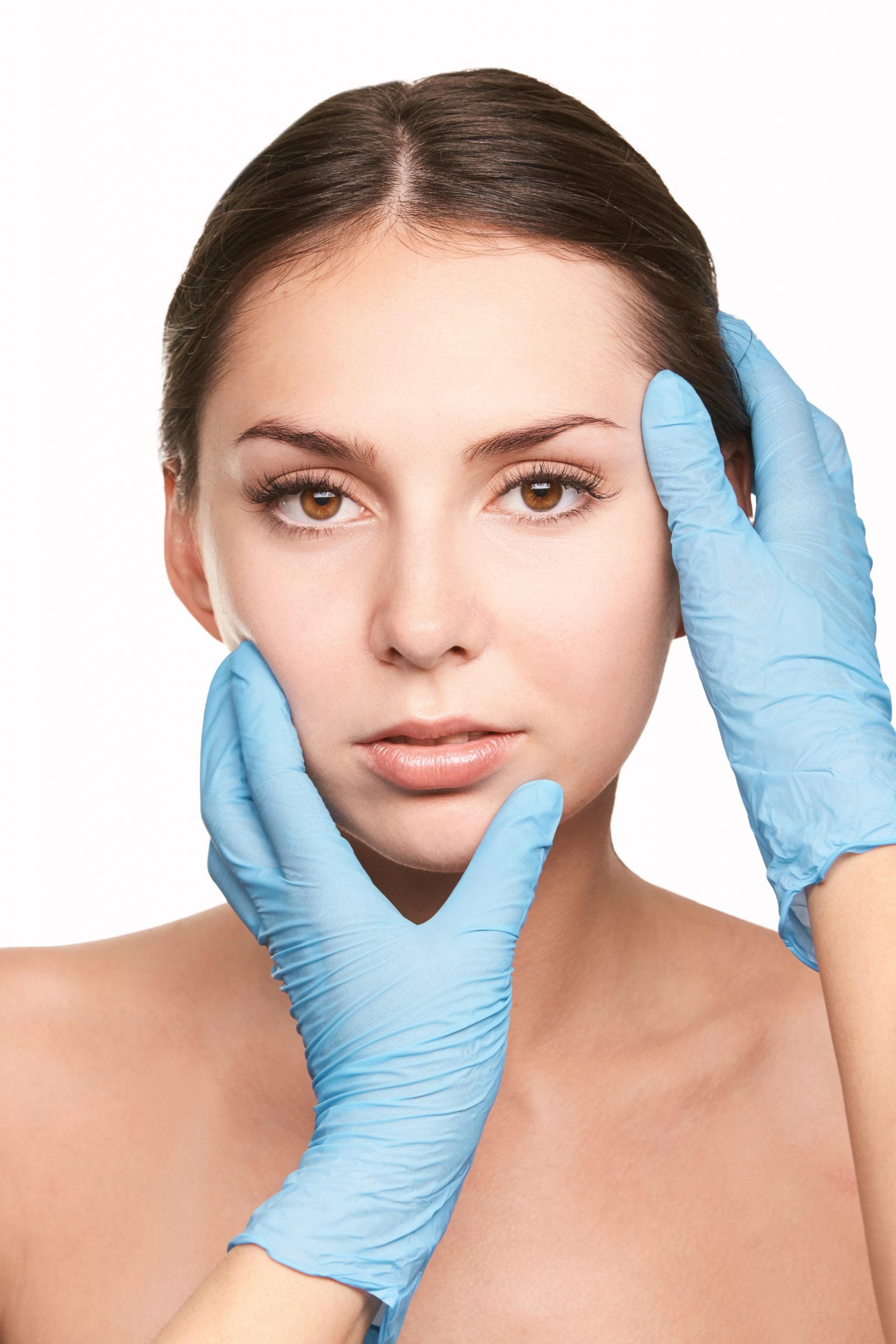 Doctor hands in protective medical gloves. Derma test. Prepare operation consultation. Pretty young woman. Face treatment. Blepharoplasty or rhinoplasty clinic. Cosmetology concept