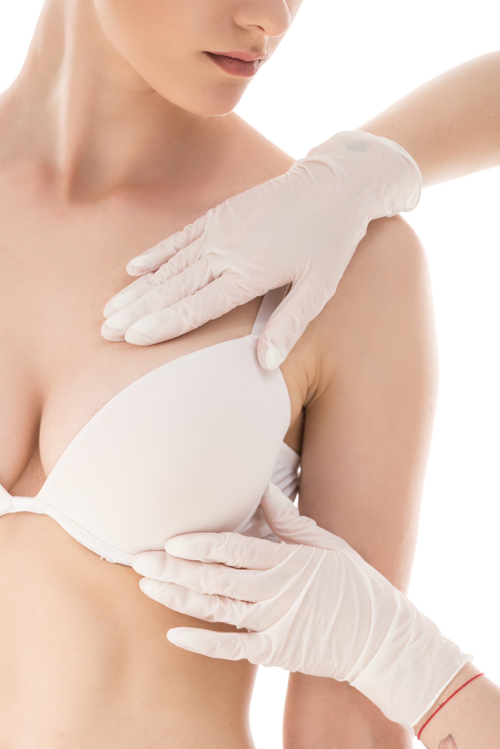 partial view of mammalogist in latex gloves examining patient isolated on white
